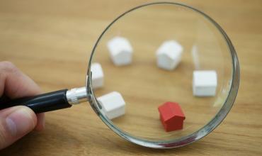 magnifying glass looking at a group of houses