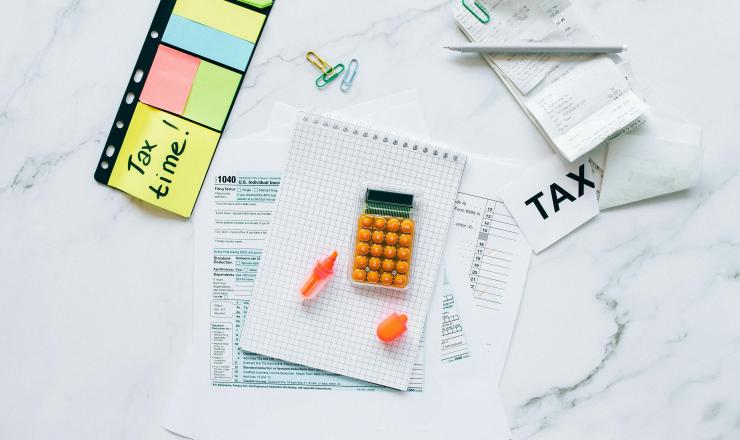 Calculator, tax form and receipts