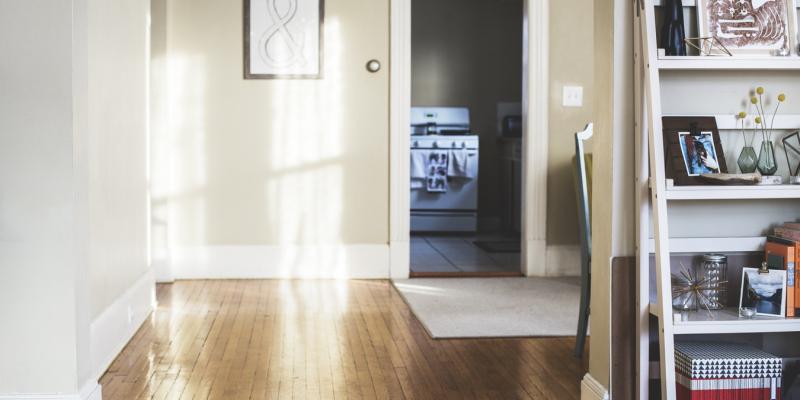 an entryway with a photo on the wall